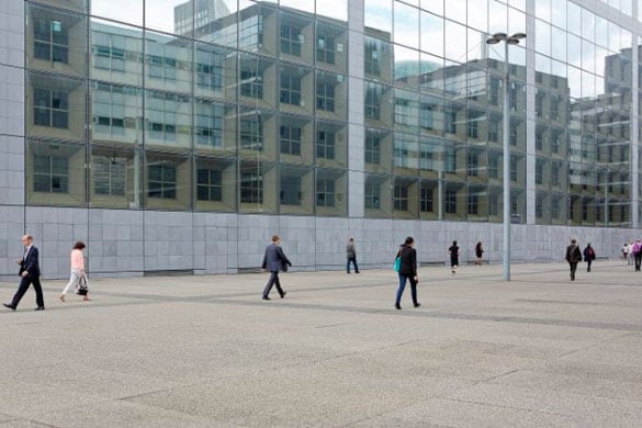 People walking next to a building