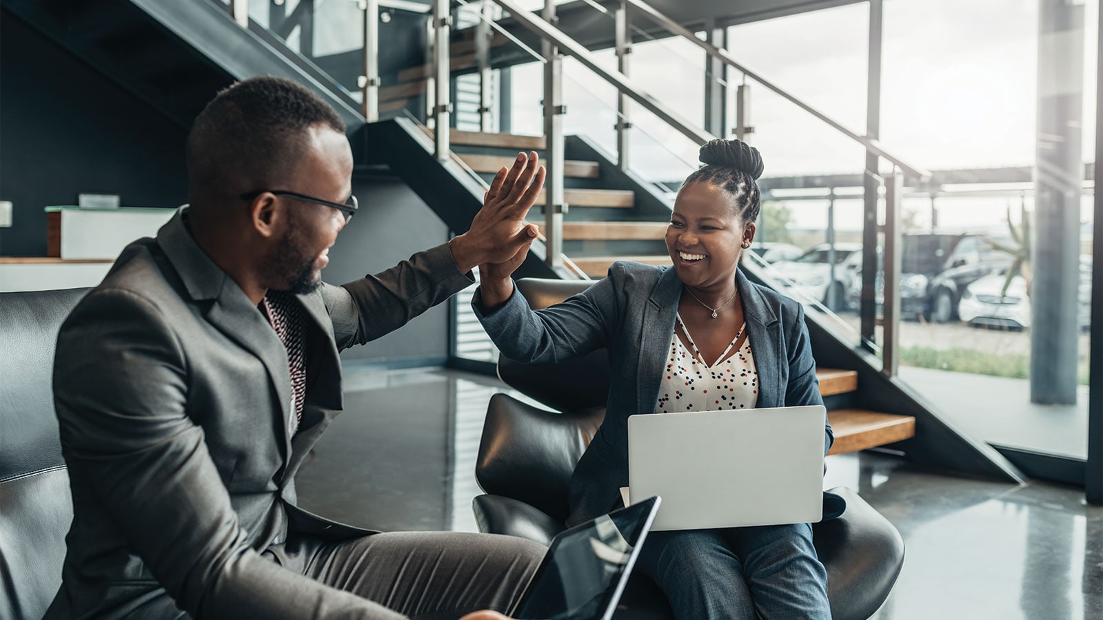 Two people given a high five.