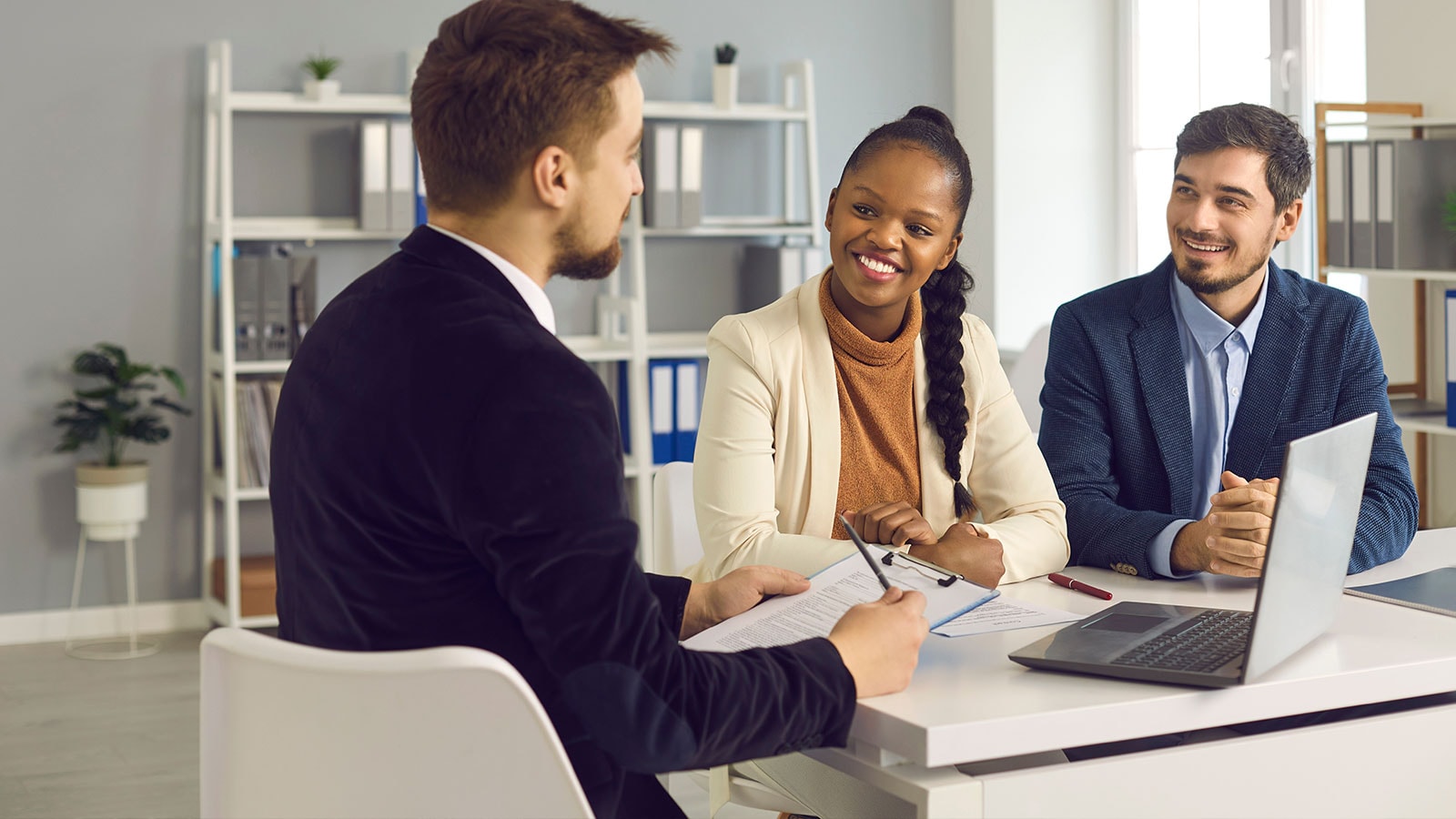 Three people discussing third party assurance.