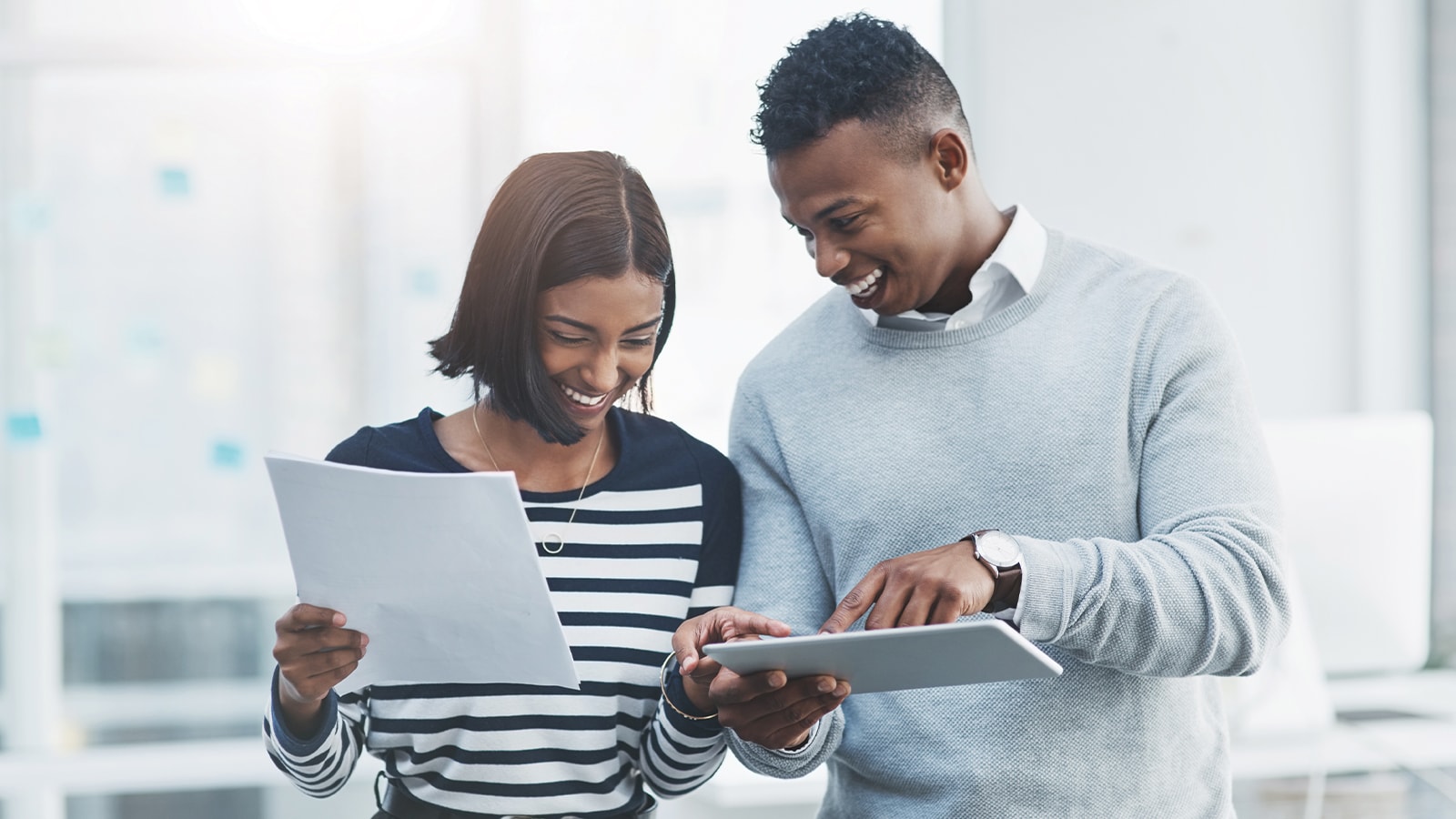 Two peopleloking at the Africa Cloud business report together.