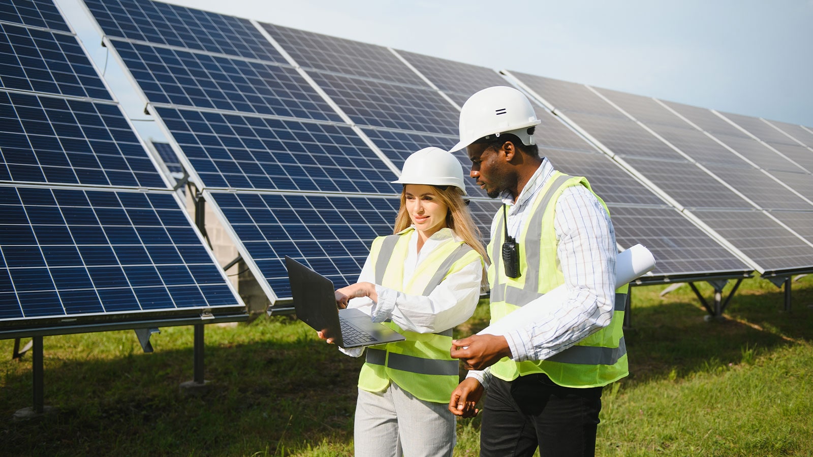 People working with solar panels.
