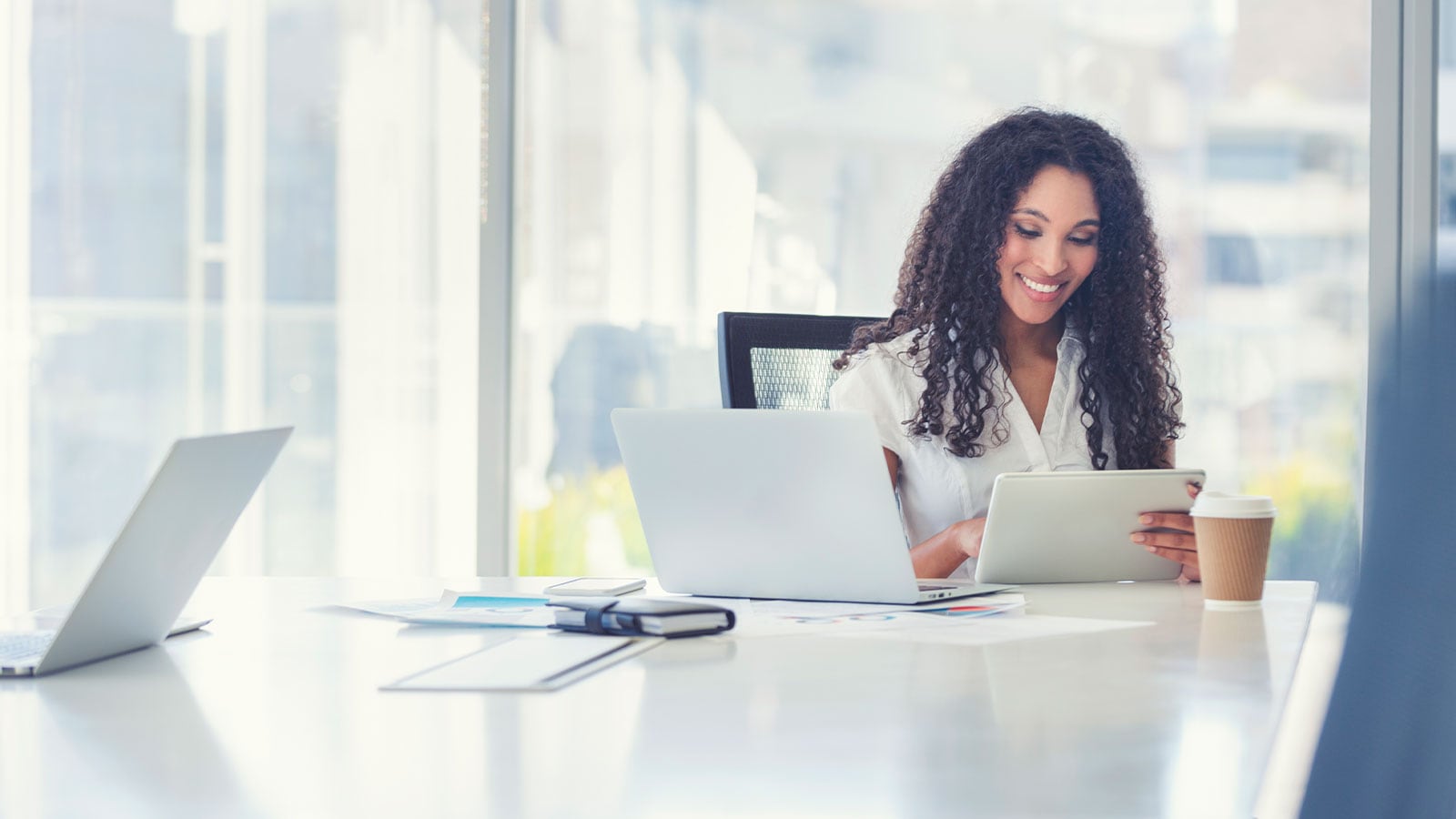 Woman sitting at her desk.