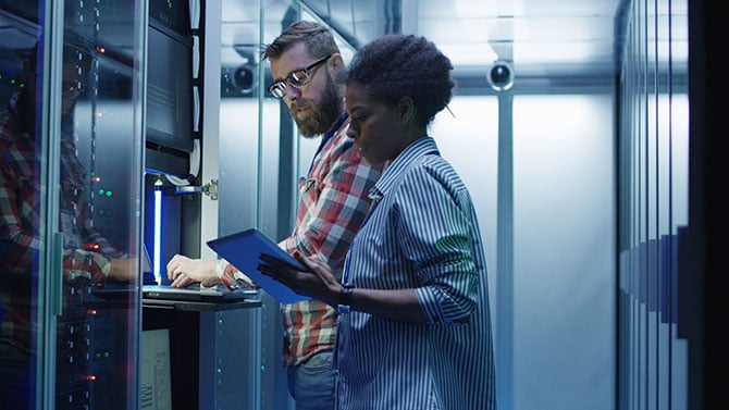 Two people working on securing.