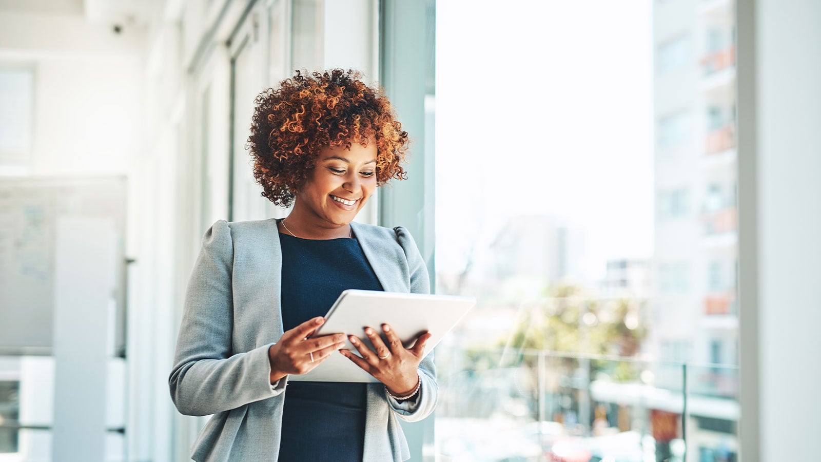 Woman looking at her tablet.