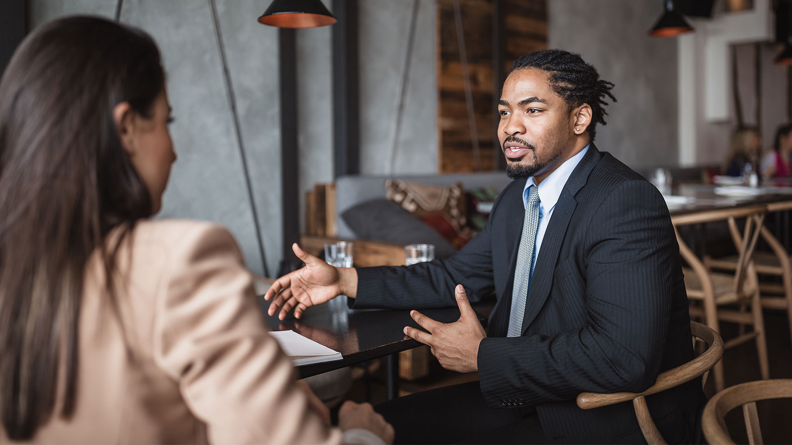 Image of a man and a woman talking.