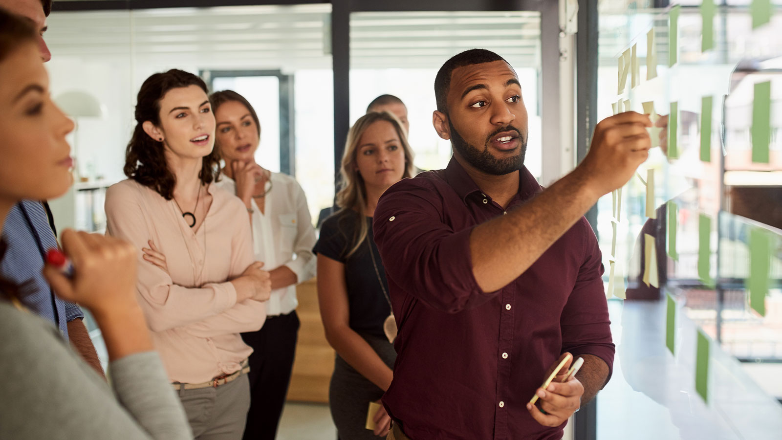Image of people working on a project together.
