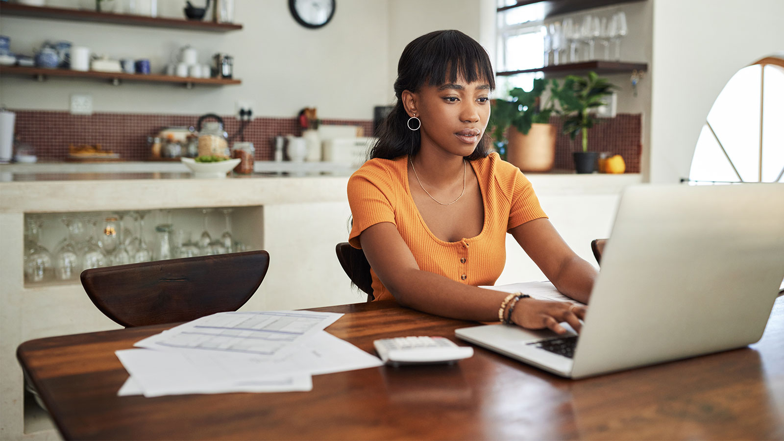 a lady working on a laptop