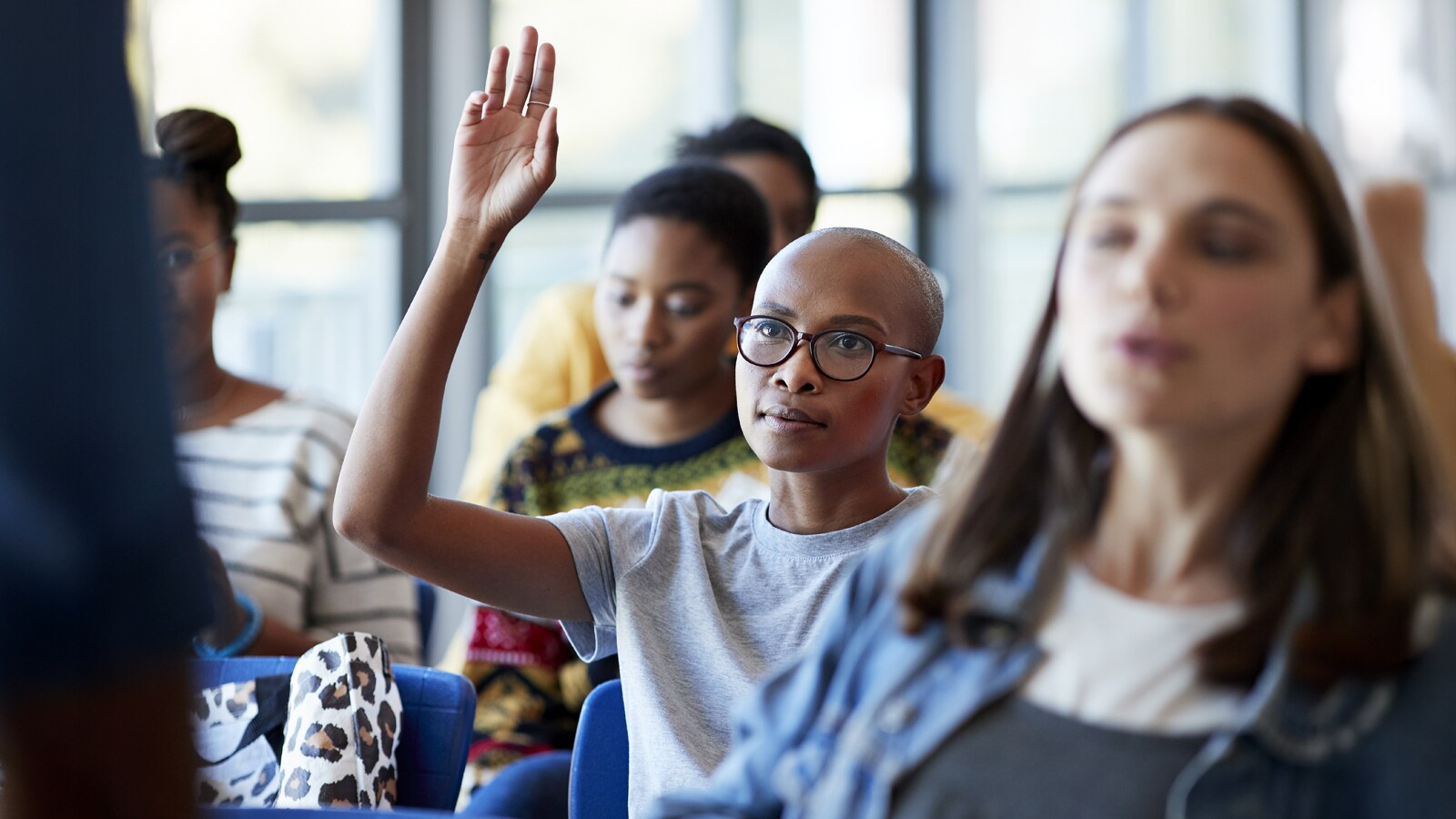 Image of a group of people in a senimaar rrom.