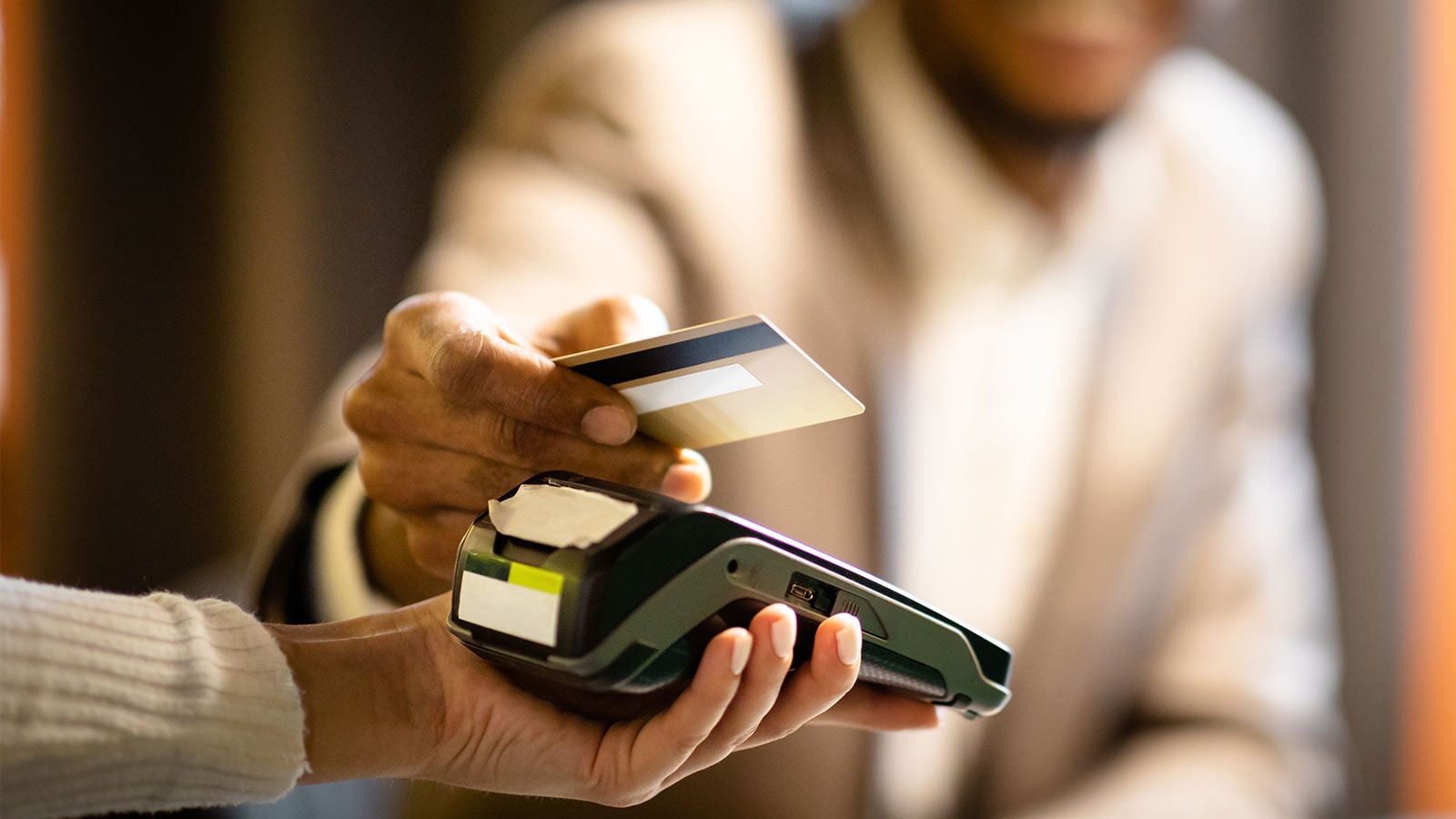 Man making a payment with his credit card.