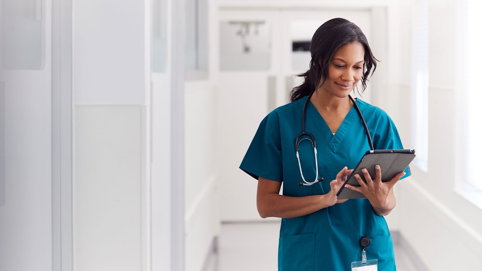 Nurse looking at an ipad.