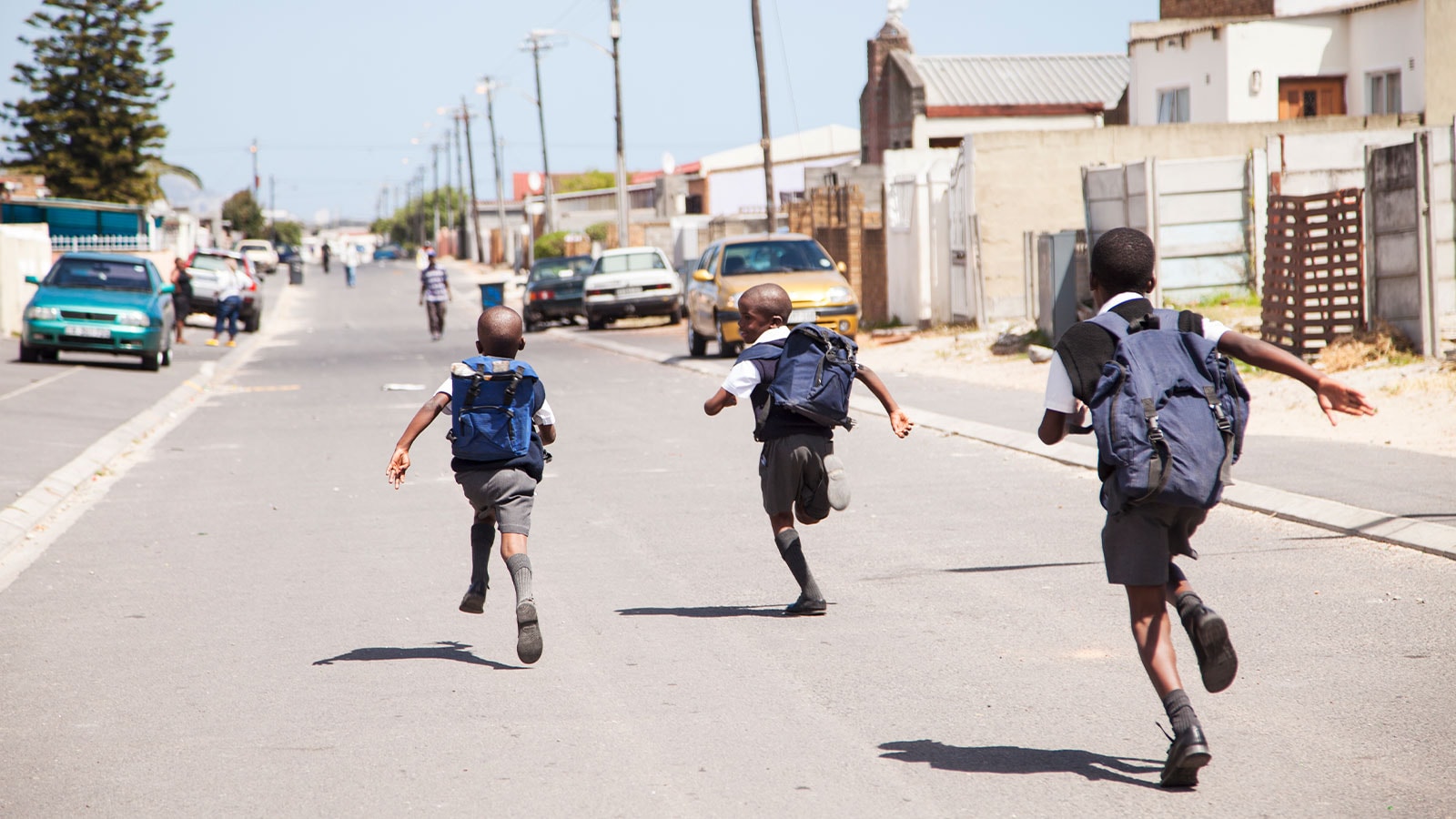 School children running around.
