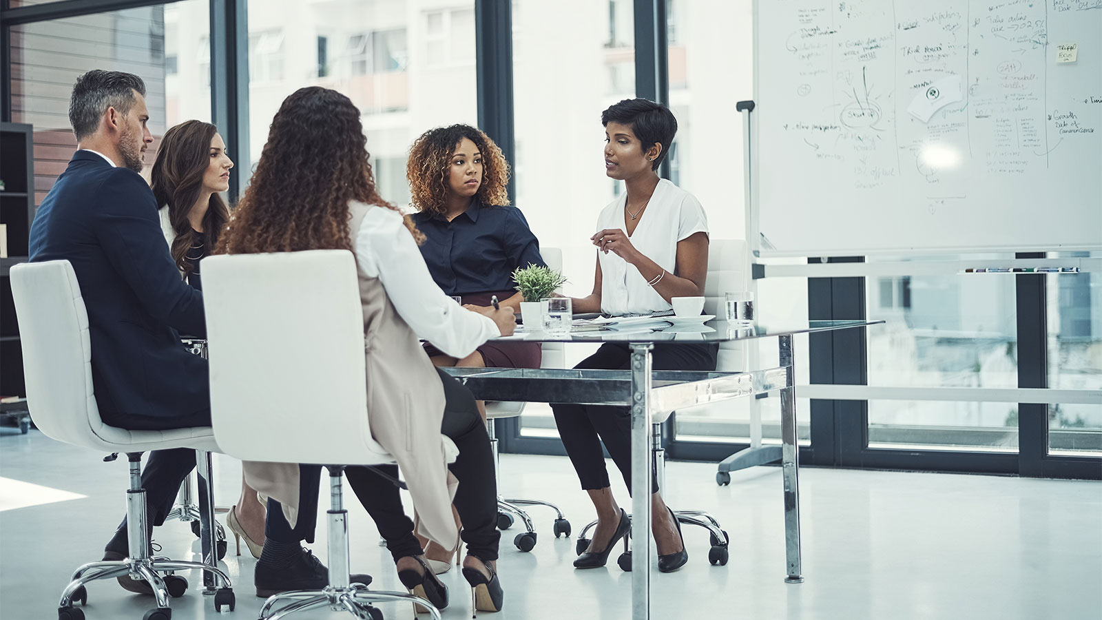 PwC professionals in a meeting.