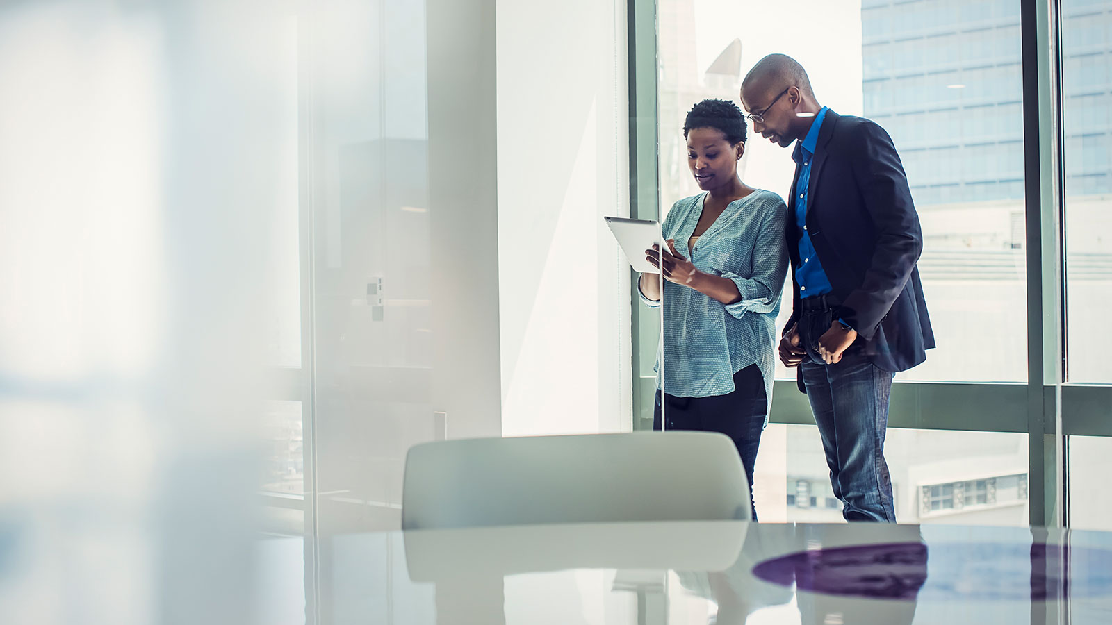 Two people discussing finacial transactions.