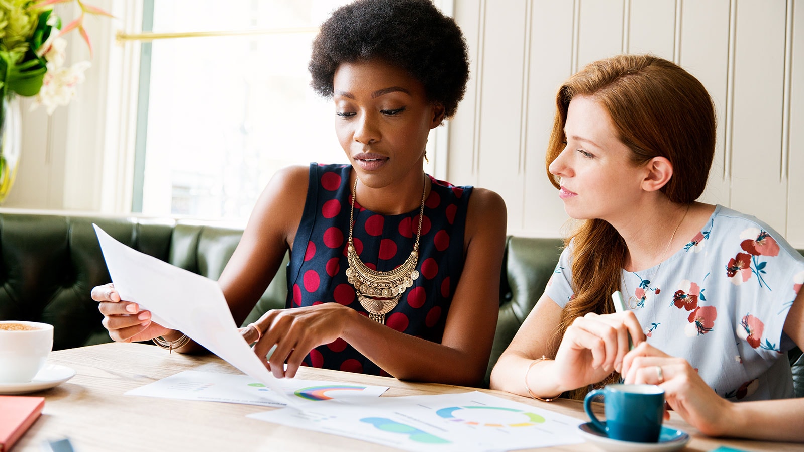 Two women working together.