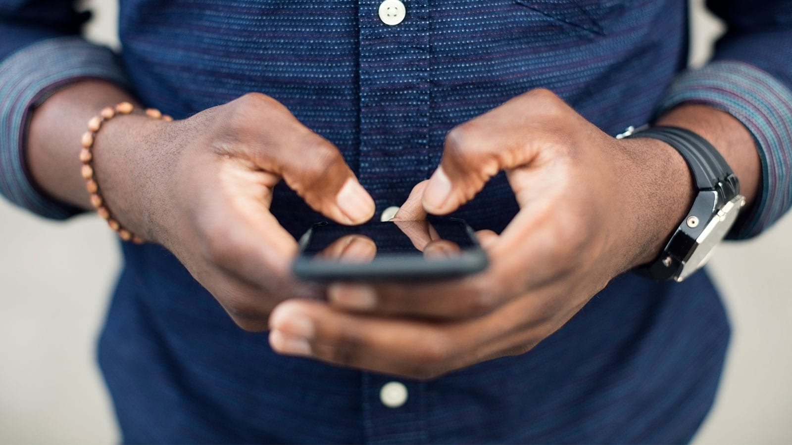 Image of a man reading about the Valuation methodology survey app on his phone.