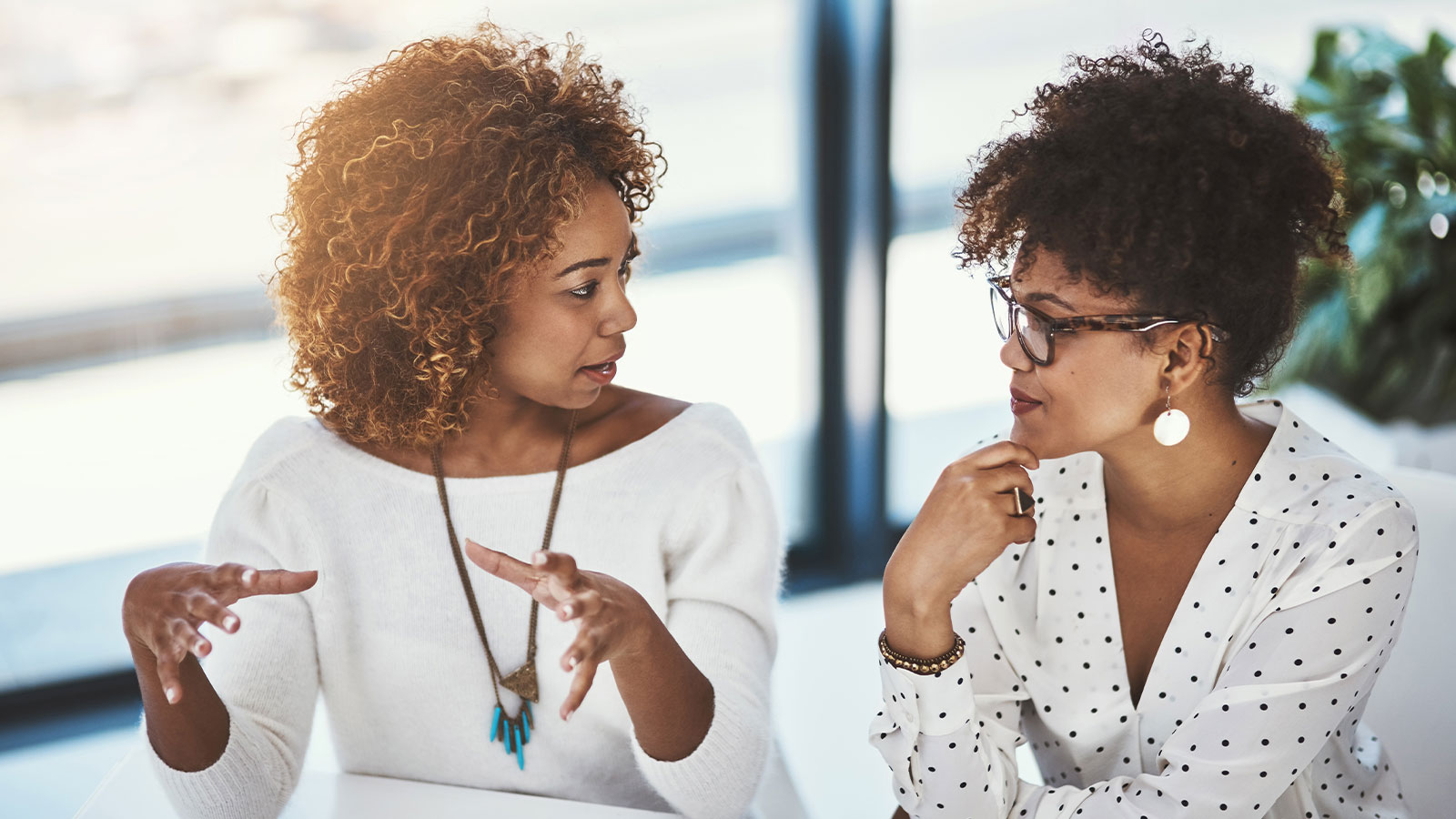 Two women talking.