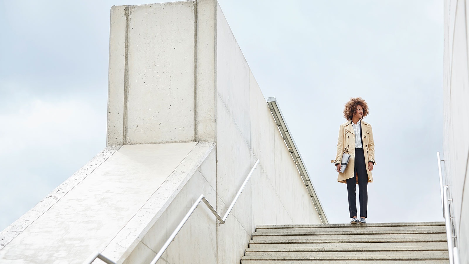 Woman standing in a bridge.