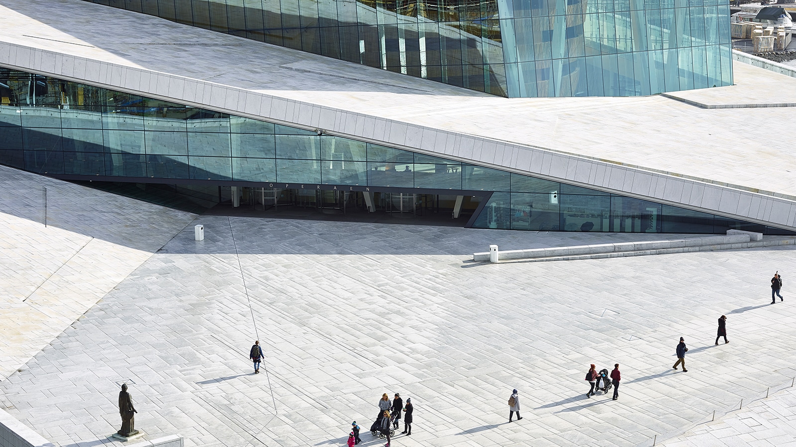 professionals walking towards a modern glass workplace