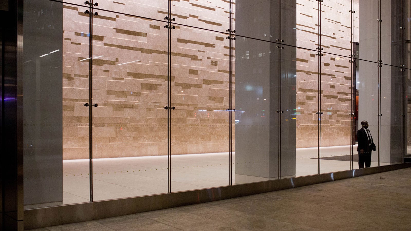 Security guard standing at building entrance