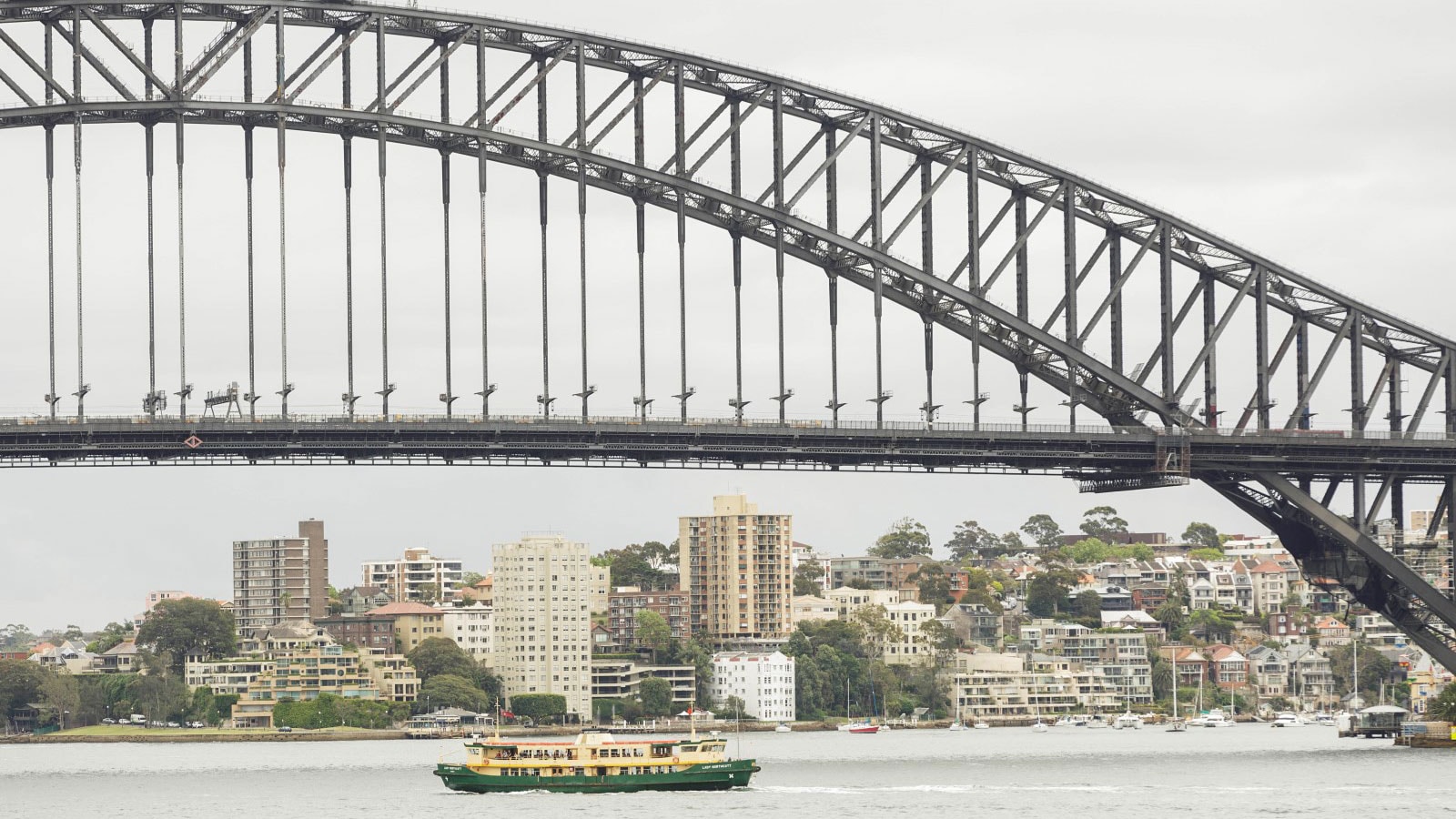a ship under a bridge
