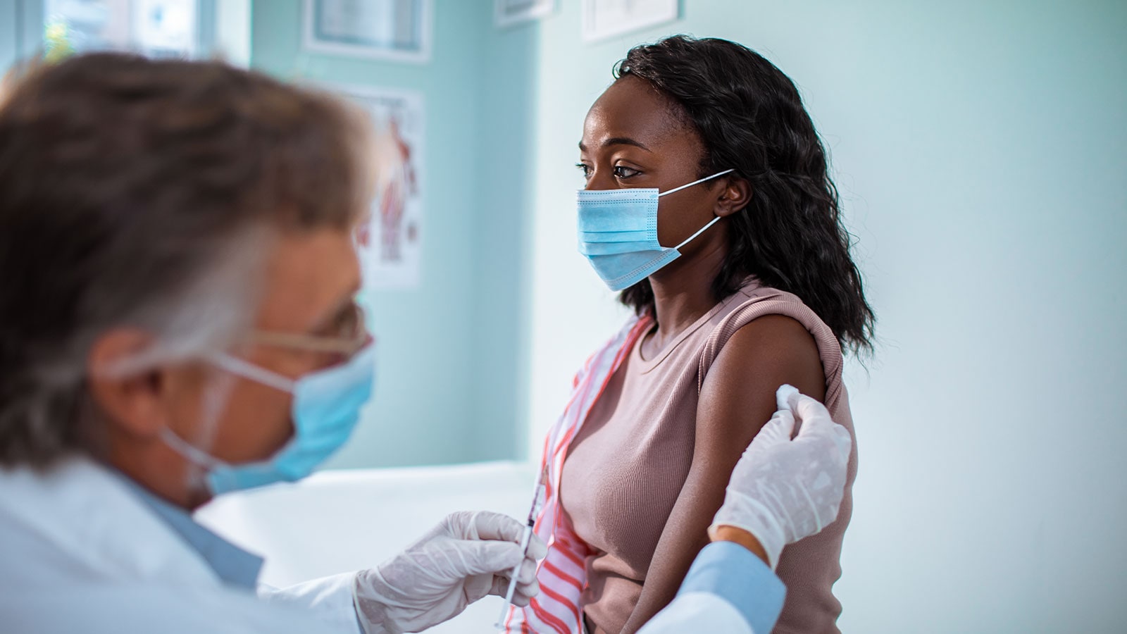 taking a vaccine shot