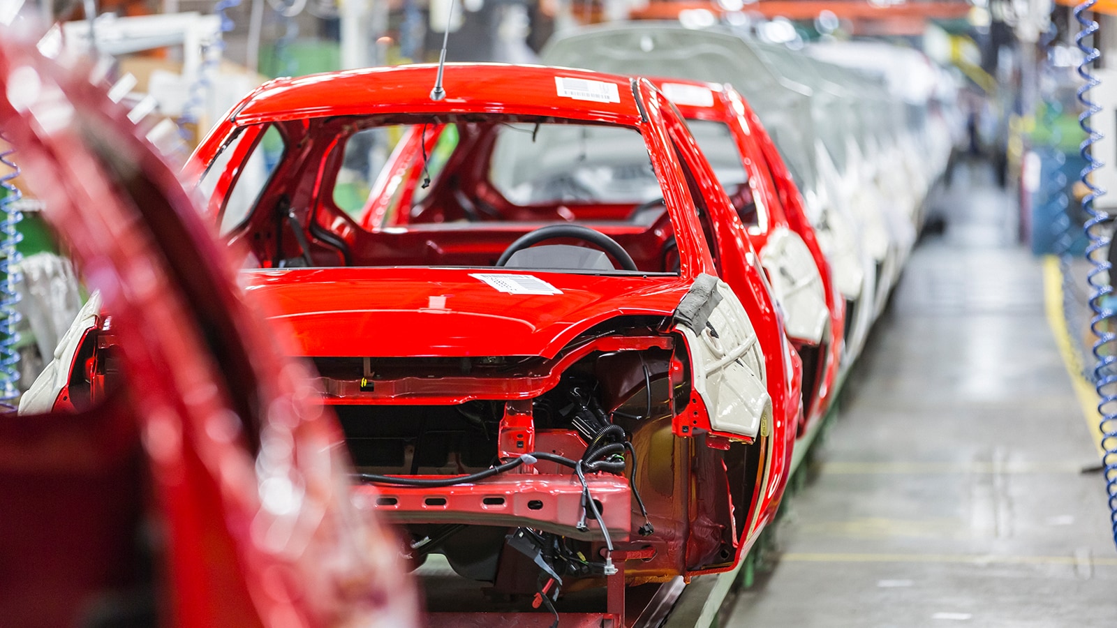 Car being made in a factory.
