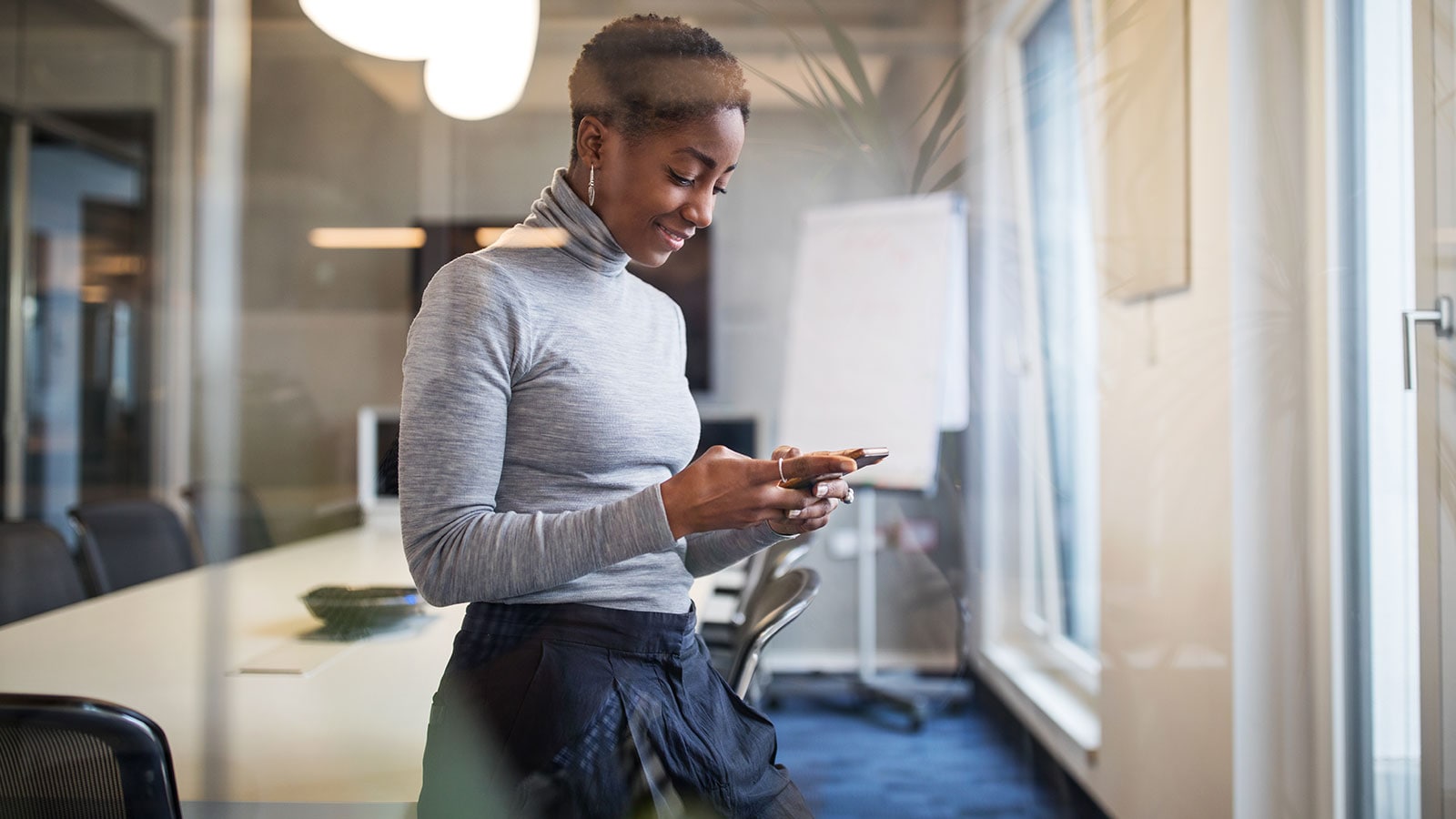 Woman reading on her phone.