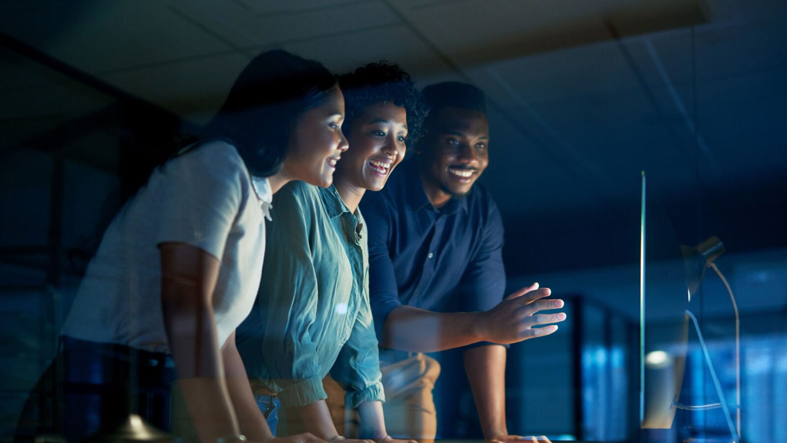 Three people talking about technology capabilities.